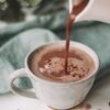 chocolate coffee pouring in white mug